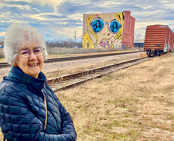 Train tracks Mona Lisa mural.